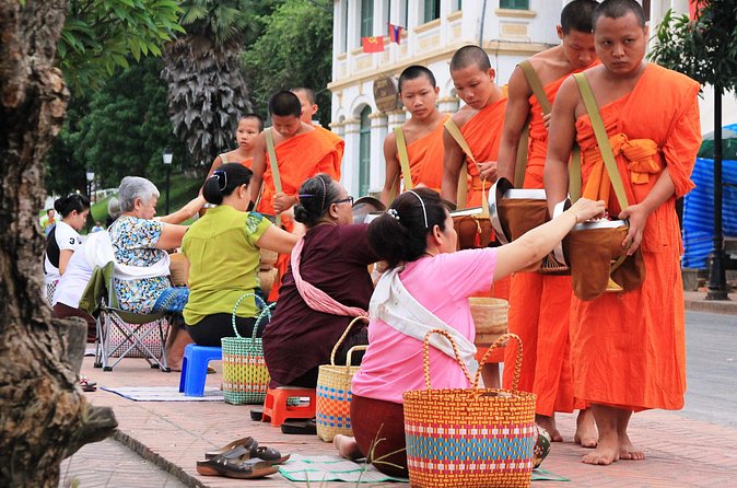 Luang Prabang Early Morning Alms Giving and Wet Market - Offering food, receiving a blessing, and the meaning of bun