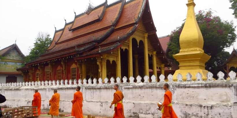 Luang Prabang: Foodie Walking Tour & Monk Blessing - Temple Time: Buddhism Lessons and the Monk Blessing Ceremony