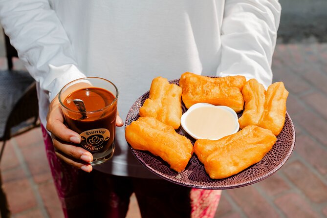 Prabang Plates Food Tour with 15+ Tastings - Stop 2: monk’s alms-giving morning markets and the food you can’t DIY